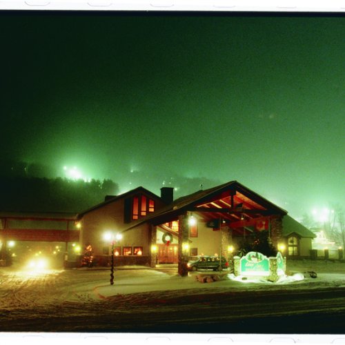 Photo of the Inn at Holiday Valley on a winters night